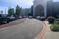 GPT-generated image of cars and driveway in front of the plaza