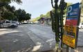 Blue and yellow paid parking sign at a medical office lot on N San Mateo Drive, warning of $88 citations and towing for unauthorized vehicles