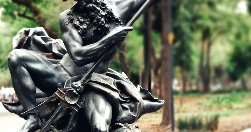 statue of poseidon in a fountain